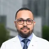 Dr. Aby John